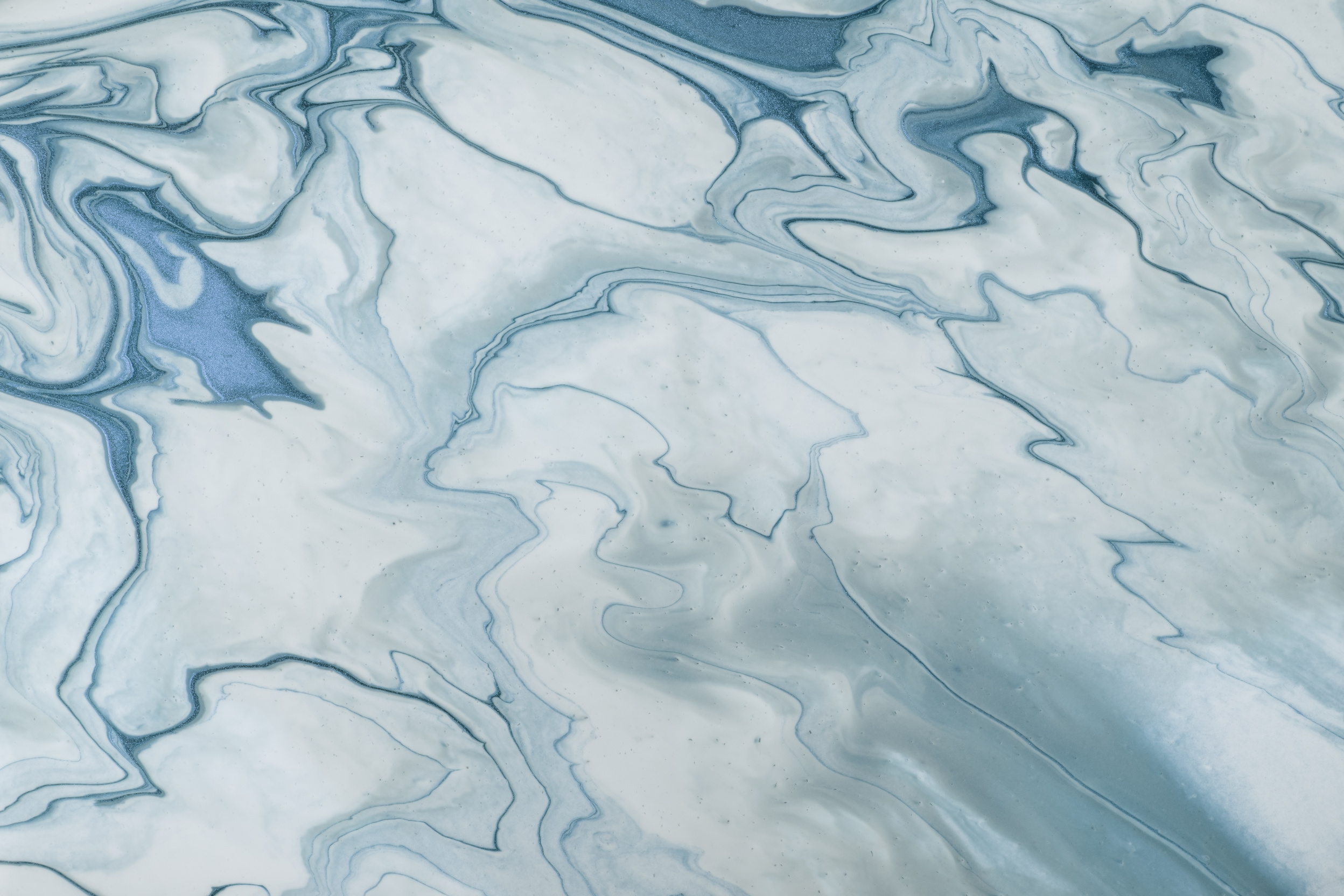 Abstract fluid art background blue and white colors. Liquid marble. Acrylic painting with denim gradient and splash.